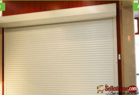 White Perforated Rolling Shutters Garage Door BY HIPHEN SOLUTION SERVICES LTD.