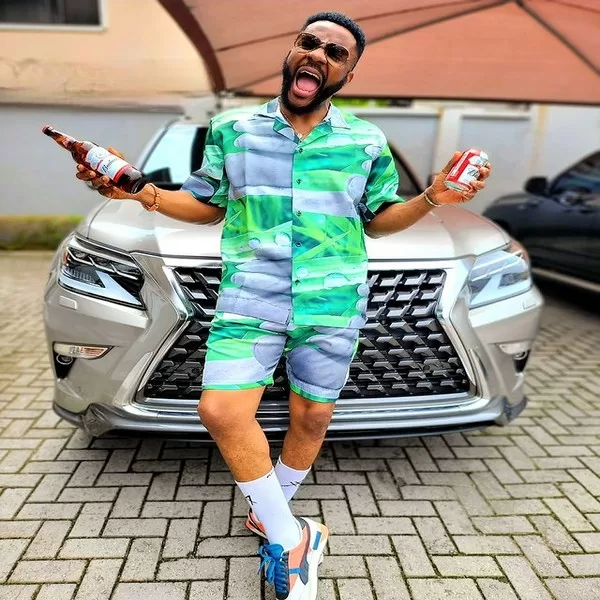 Ebuka Obi-Uchendu posing with his Lexus GX 460 SUV